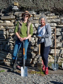 Felicity Jefferies and Stephanie Smith prepare for a day of planting native trees.